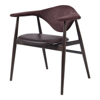 "Elegant chair featuring rich burgundy upholstery and dark wooden legs, with a modern sculptural design."