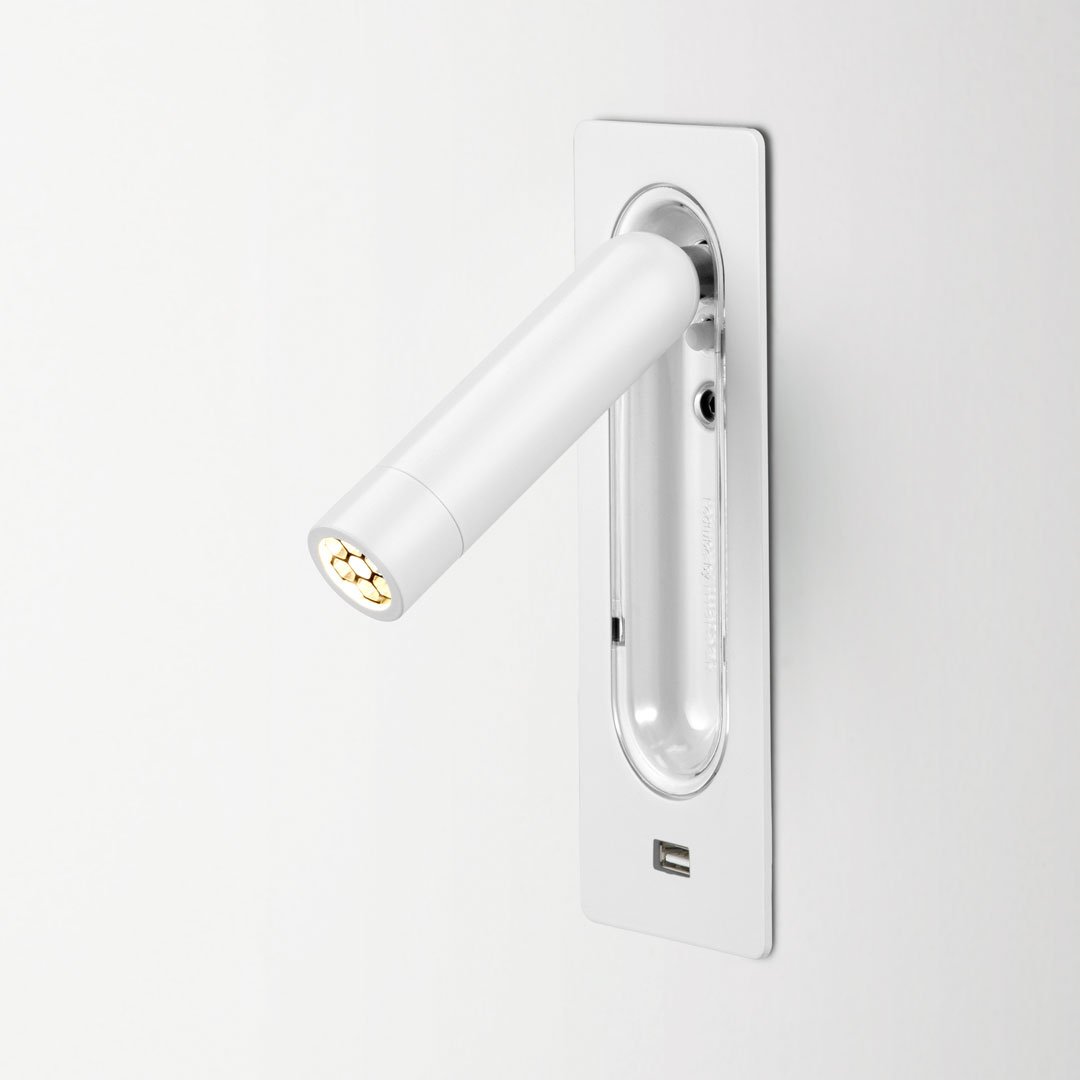 Sleek white LED wall light with a shiny chrome finish, featuring a minimalist design and modern aesthetic.