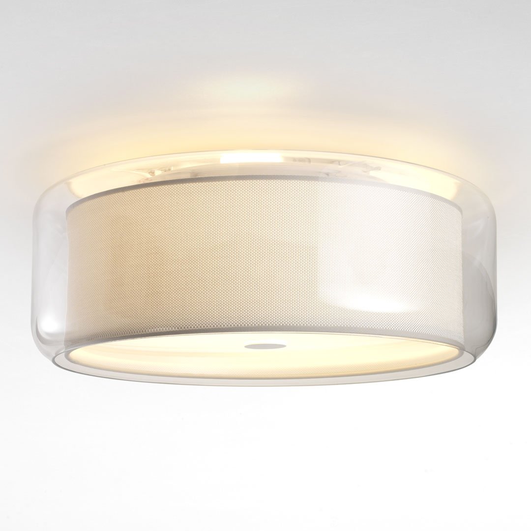 Modern round ceiling light featuring a soft white fabric shade and transparent plastic rim, creating an elegant glow.