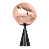 Copper globe on a black cone base, featuring a smooth, reflective surface and modern geometric design.