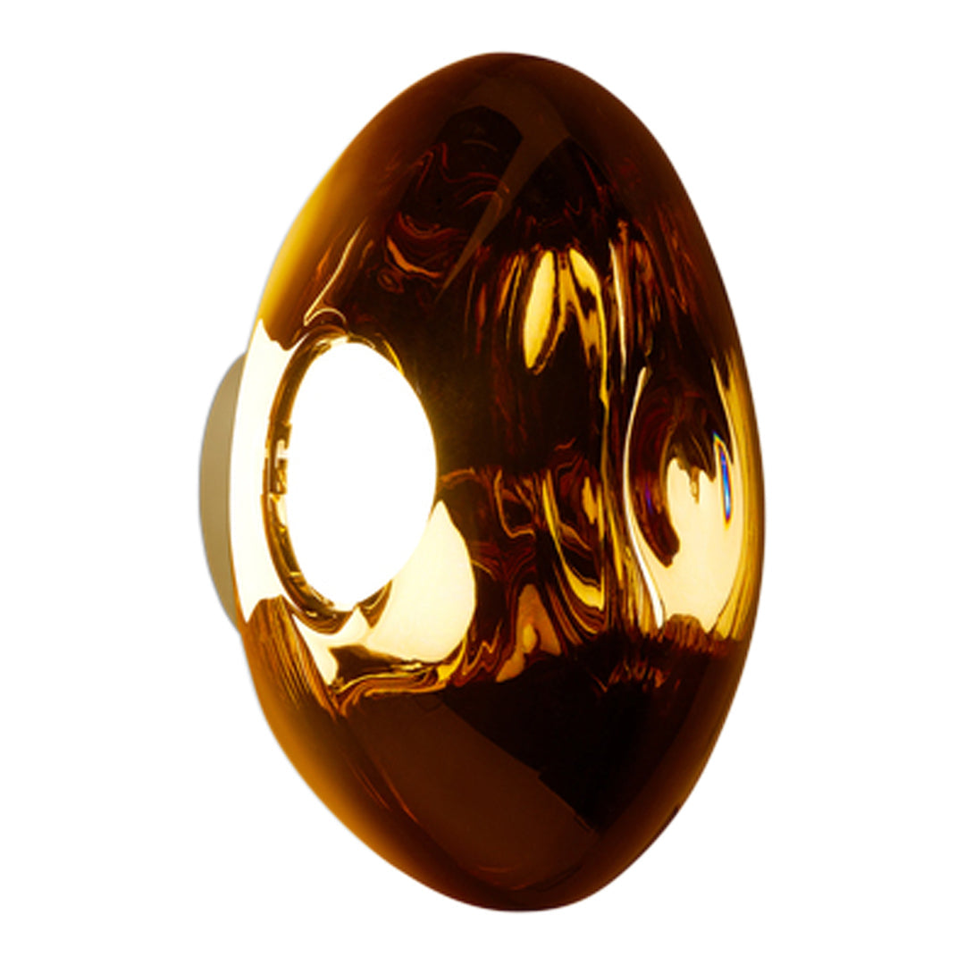 Amber-colored decorative object with a smooth, glossy surface and a unique oval shape. Elegant and modern design.