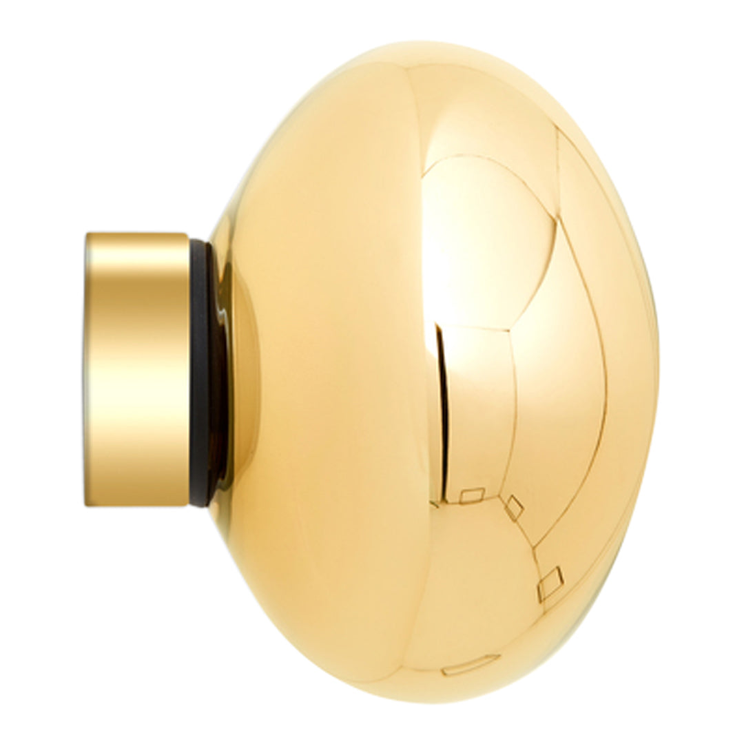 "Shiny gold round cabinet knob with smooth surface and sleek modern design."