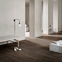 Modern interior featuring earthy tones, light wood accents, and minimalist patterns for a serene ambiance.