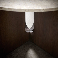 "Elegant marble top with warm wood tones and sleek, contemporary cut-out pattern."