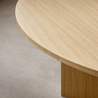 "Light wood grain finish with a smooth, rounded edge texture on a minimalist table."