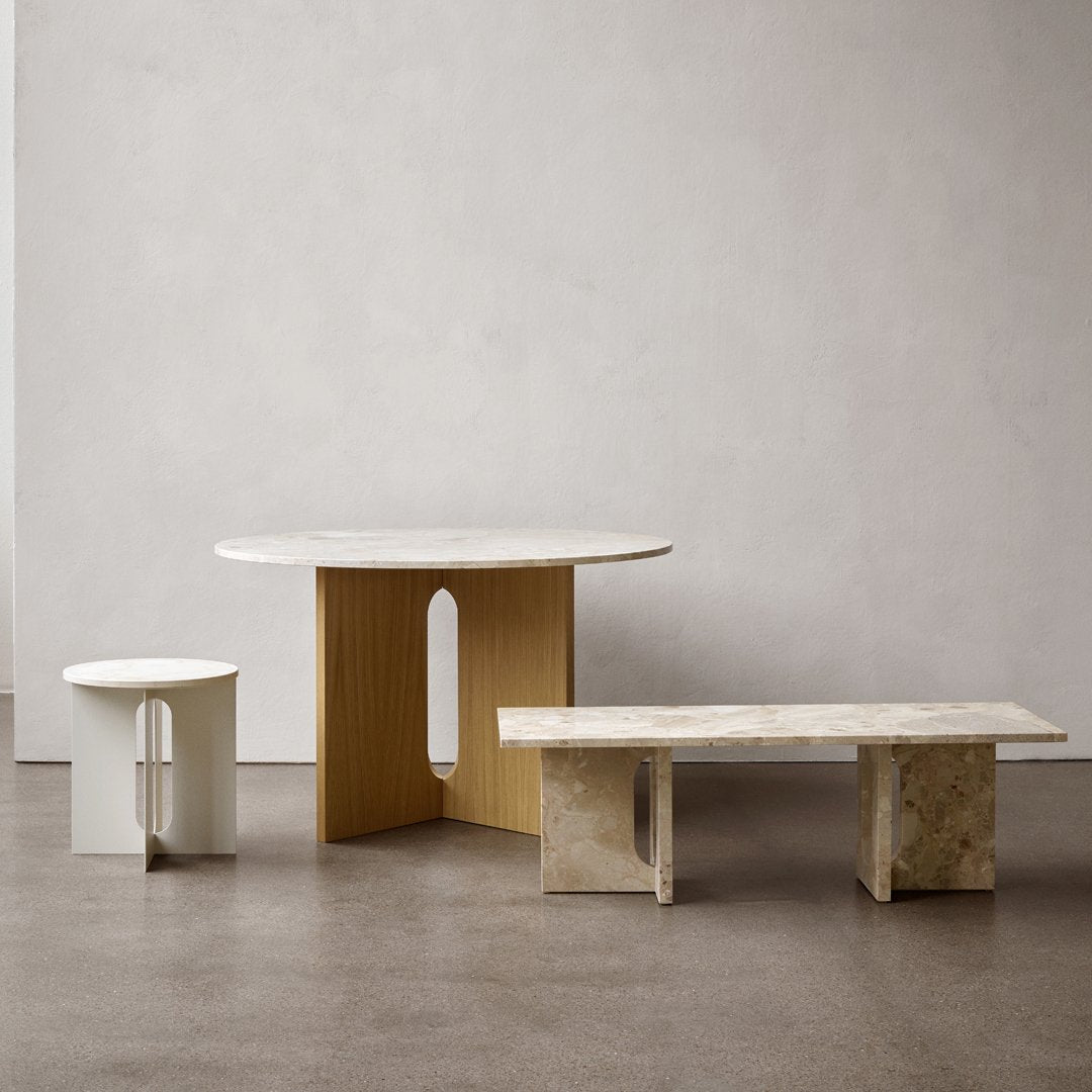 Stylish set of three tables featuring white, beige, and marble finishes with modern geometric patterns.