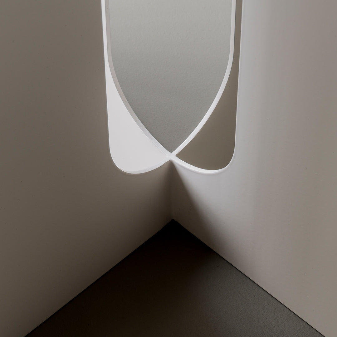 Modern white design with smooth curves and a minimalist aesthetic, featuring soft shadows and clean lines.