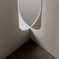 Modern white design with smooth curves and a minimalist aesthetic, featuring soft shadows and clean lines.