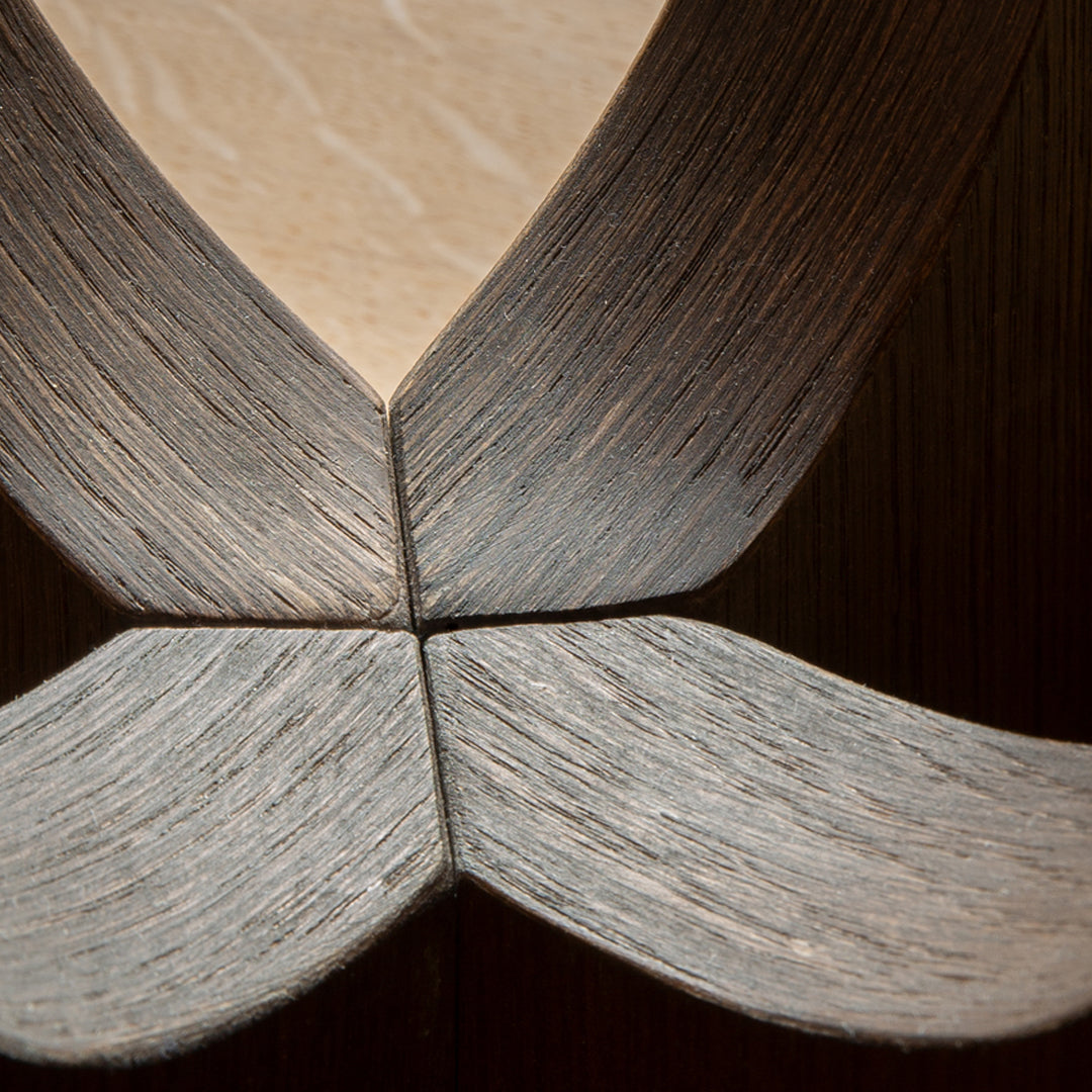 Close-up of wood grain with subtle beige and gray tones, featuring a unique, intersecting pattern. Perfect for decor.