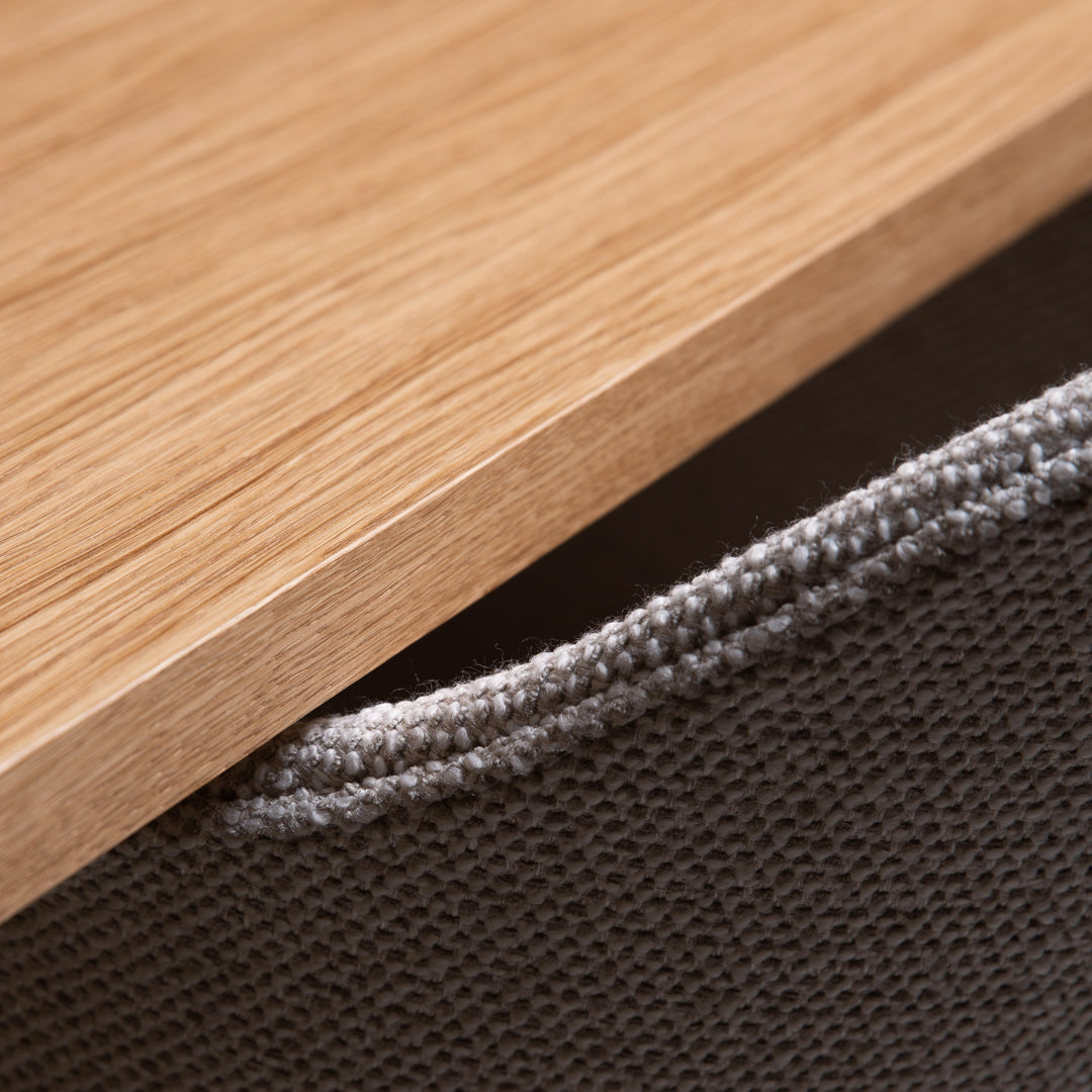 Natural oak wood finish with a textured gray fabric edge, highlighting modern design and minimalistic style.