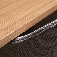 Natural oak wood finish with a textured gray fabric edge, highlighting modern design and minimalistic style.