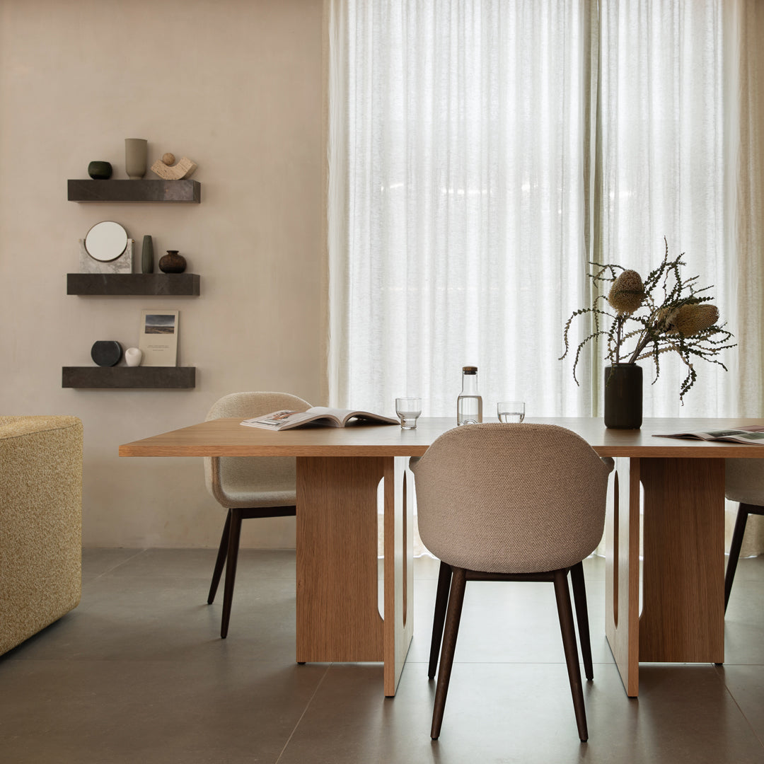 Elegant light beige table and chairs with soft textures, earthy tones, and warm wooden accents against a neutral background.