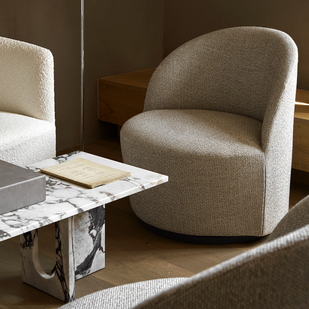 Gray and cream curved accent chairs with textured fabric, paired with a marble-patterned table.
