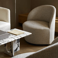 Gray and cream curved accent chairs with textured fabric, paired with a marble-patterned table.