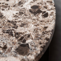 Brown marble tabletop featuring intricate veining and a polished surface with varied stone patterns.