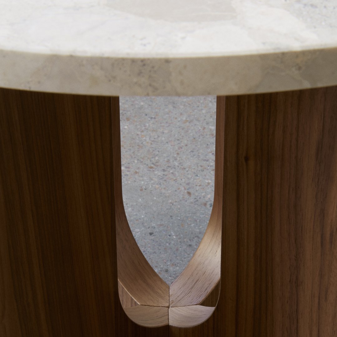 Natural wood grain with a smooth, light-colored marble top and subtle cut-out design for contrasting patterns.