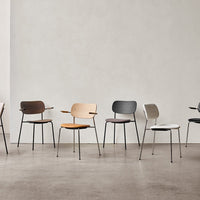 "Variety of modern chairs in colors: brown, light tan, grey, orange, white, and black, featuring sleek minimalist designs."