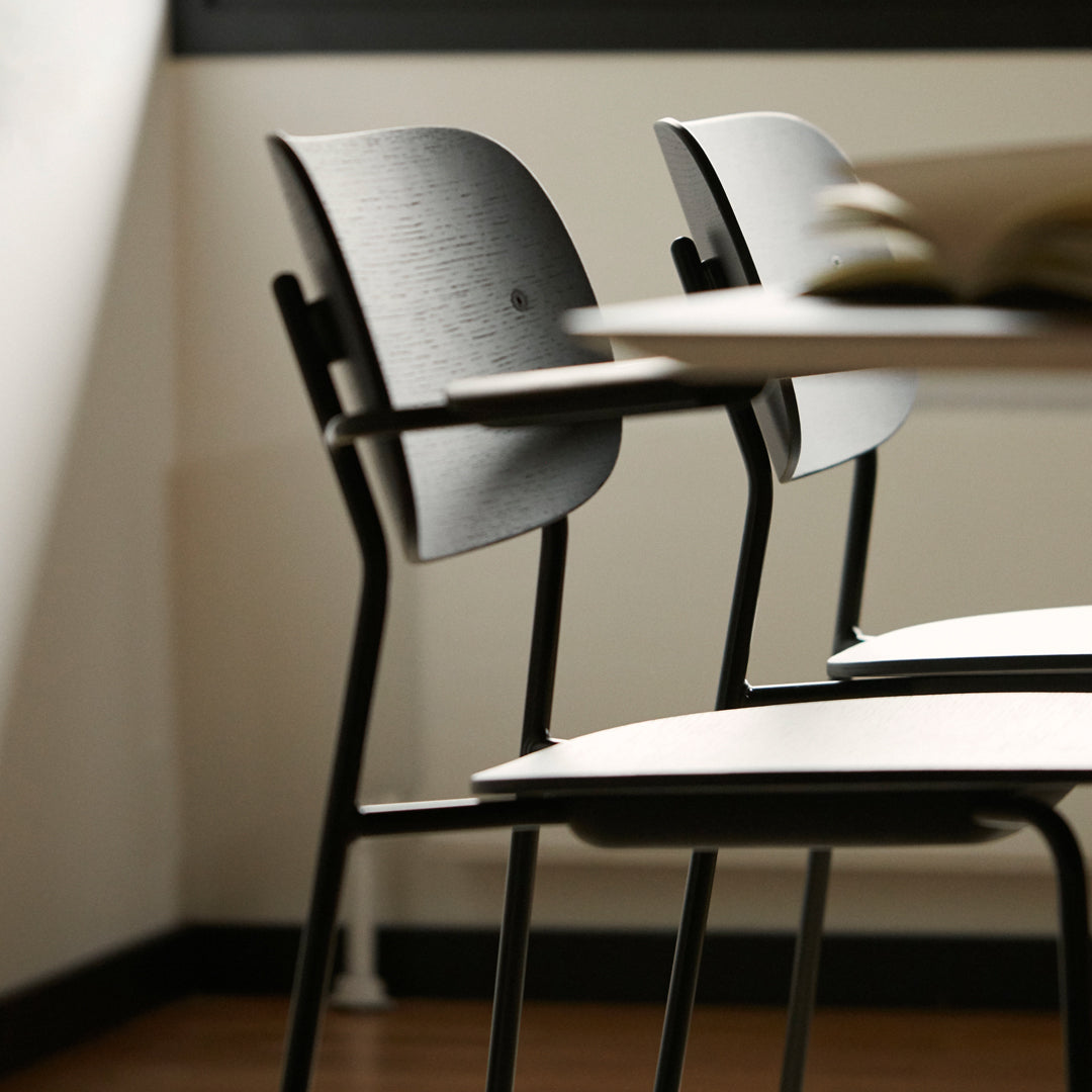 Black and light wood chair with sleek design, featuring a minimalist, contemporary pattern for modern spaces.