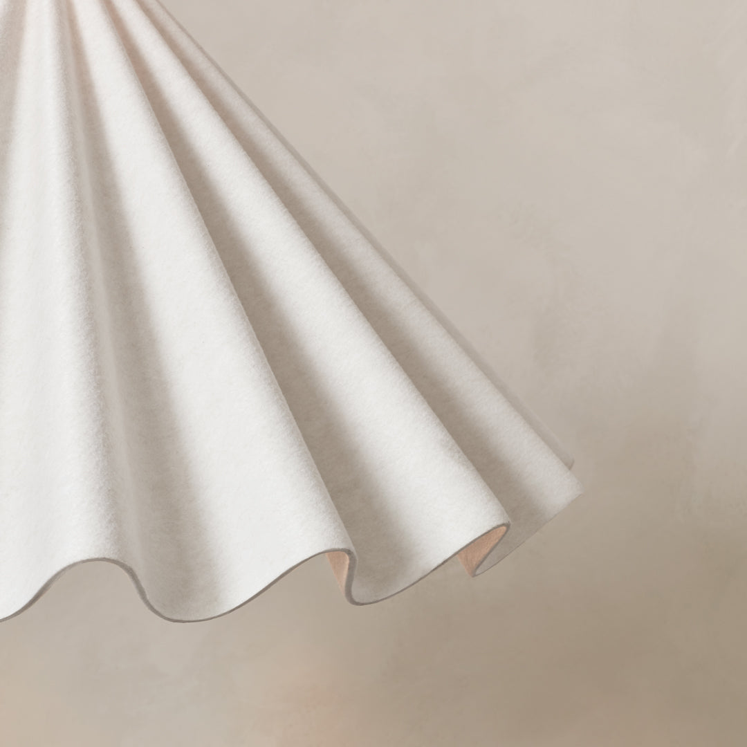 White corrugated fabric with soft curves, perfect for adding texture and elegance to any space.