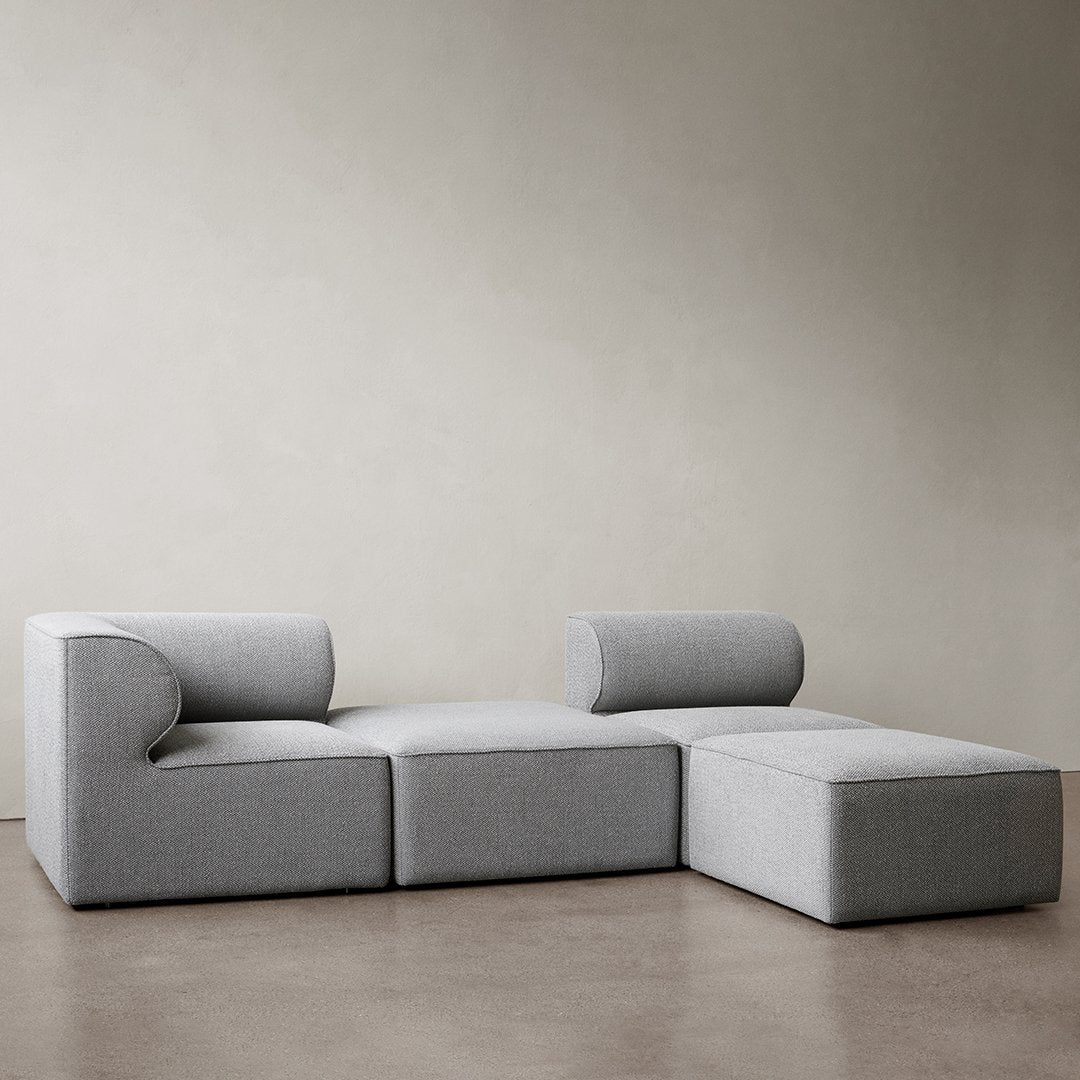Stylish gray modular sofa with smooth fabric and contemporary design, perfect for modern living spaces.