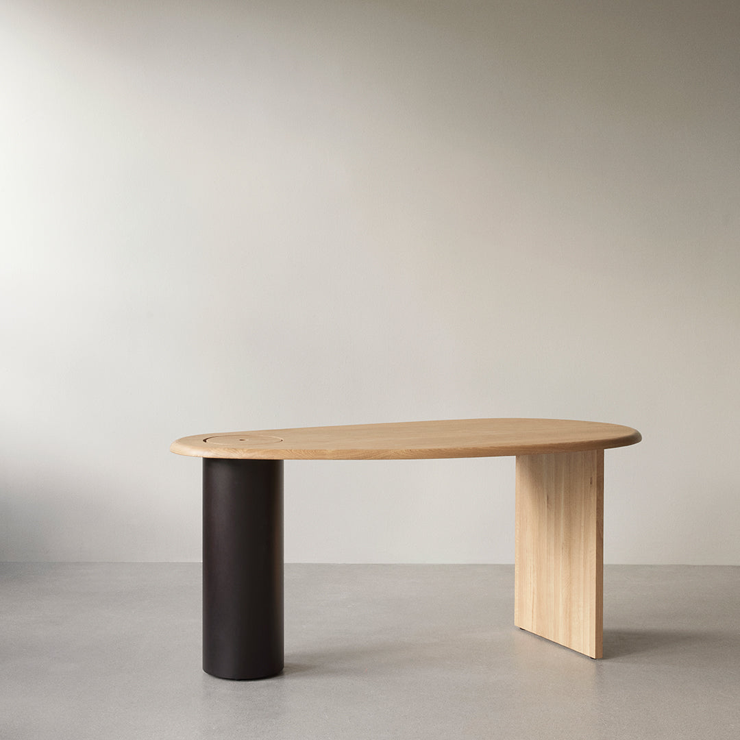 Natural wood tones with a sleek light finish, accented by a contrasting dark cylindrical base. Modern minimalist design.