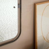Modern wall decor featuring soft beige tones, warm wood accents, and minimalist abstract patterns.