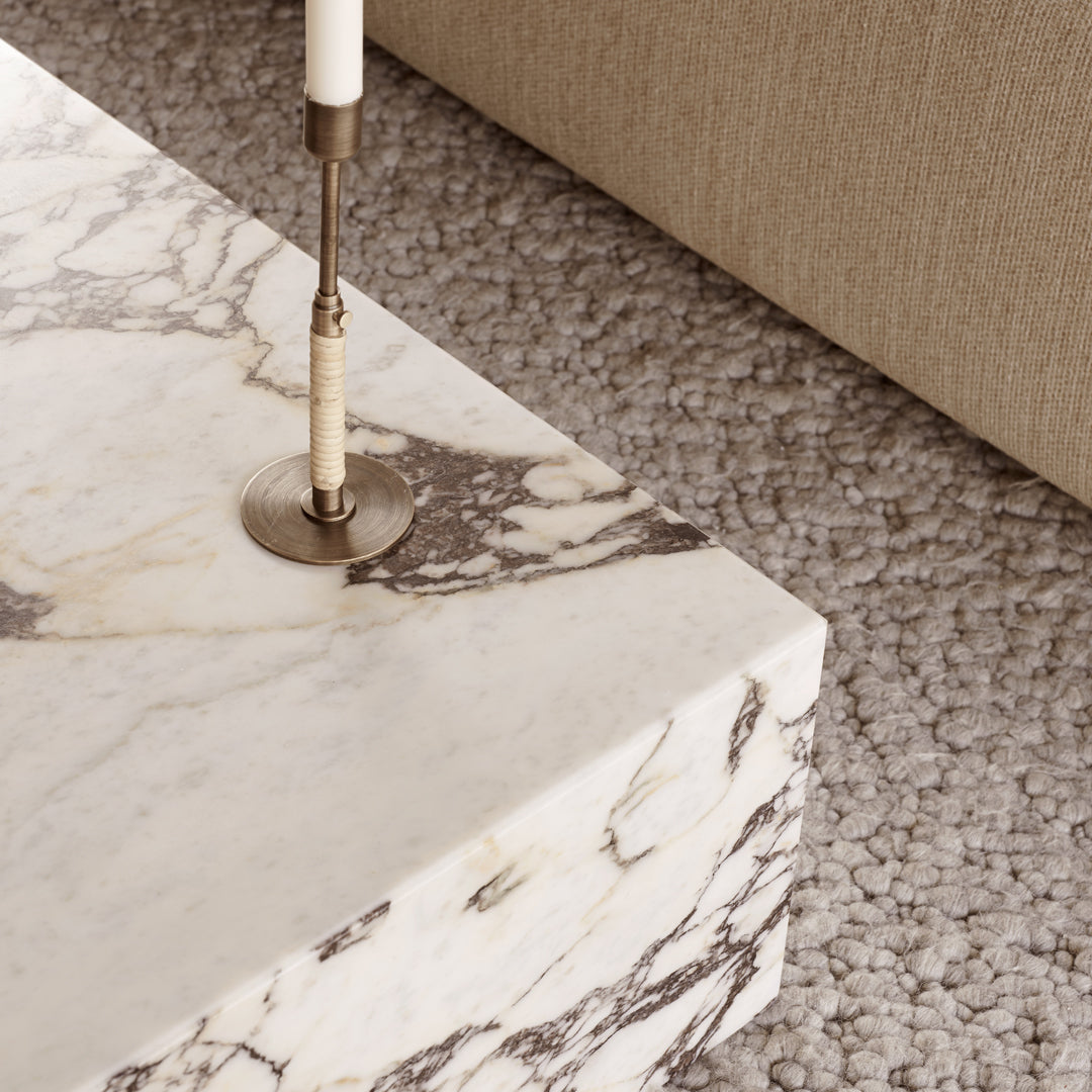 Elegant white marble coffee table with gray veining and a polished surface, perfect for modern living spaces.