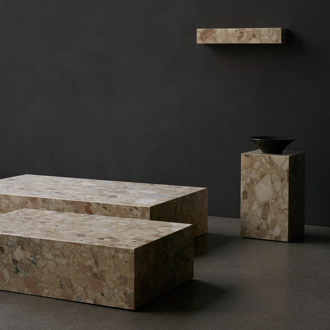 Textured beige stone furniture on a dark background, featuring subtle pink and gray patterns for a modern aesthetic.
