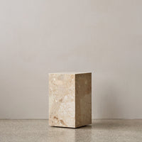 Beige stone pedestal with subtle veining on a smooth surface, set against a neutral background. Ideal for modern decor.