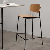 Wooden bar stool with a light brown seat and black metal frame, featuring a minimalist design and smooth finish.