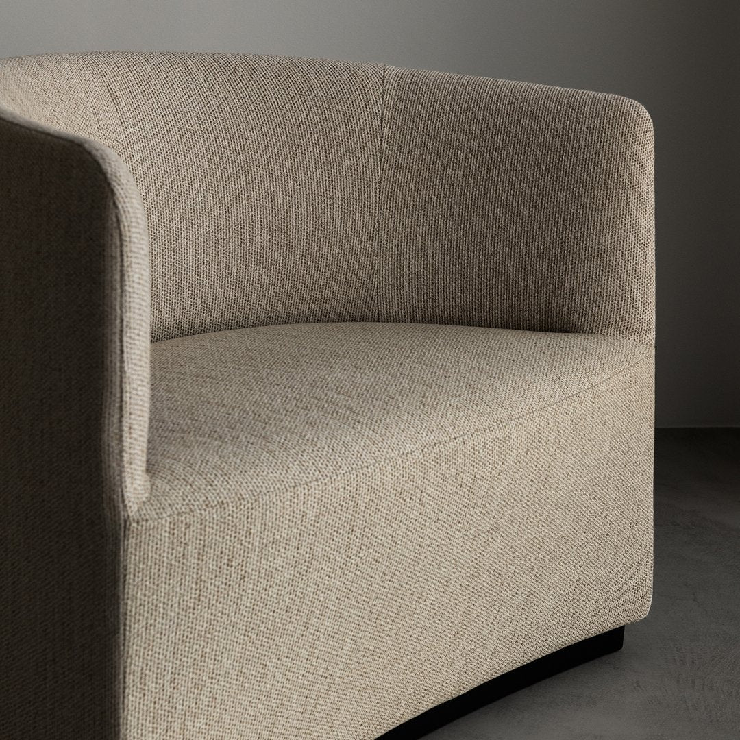 Beige textured upholstery with subtle flecks, curved design showcasing minimalist elegance.