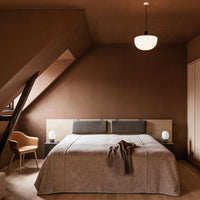 Cozy brown bedroom with textured beige bedding and soft neutral accents, creating a warm and inviting atmosphere.