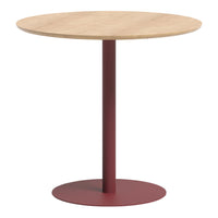 Round table with a natural wood top and a maroon metal base, featuring a sleek minimalist design.