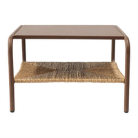 Brown metal coffee table with a woven rattan shelf, featuring a minimalist design and earthy tones.