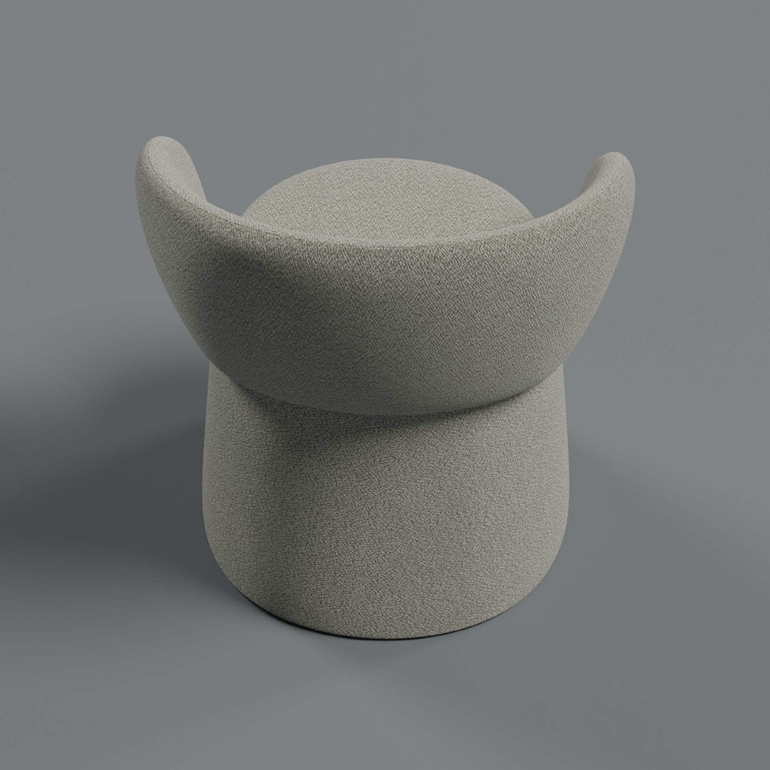 Soft grey upholstered stool with smooth, minimalist curves and a modern design. Perfect for stylish decor.