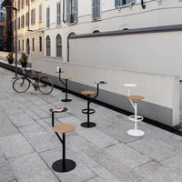 "Colorful outdoor bar stools in black, white, and natural wood finish, featuring sleek, modern designs."