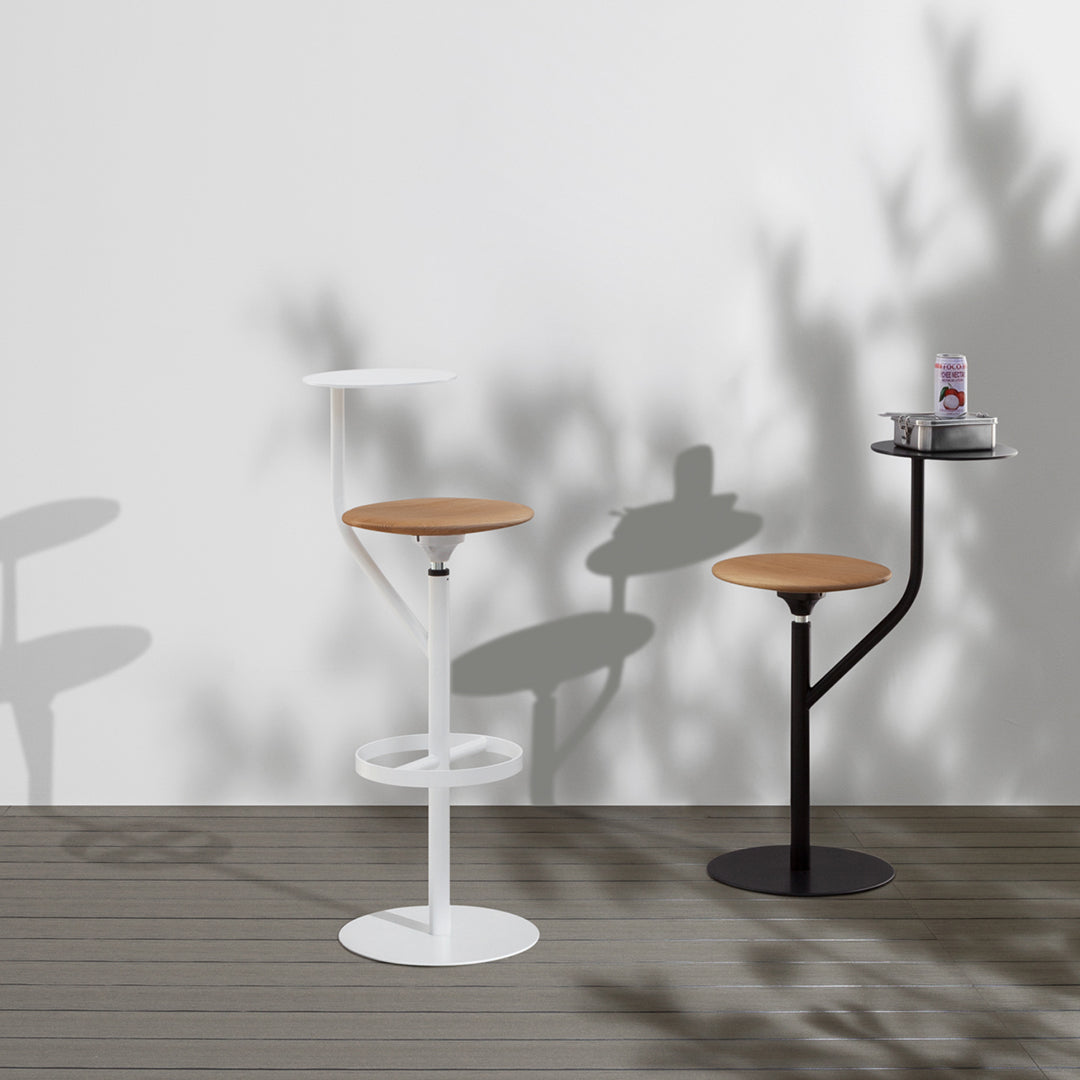 Modern bar stools with white and black metal bases and natural wooden seats, featuring sleek, minimalist designs.