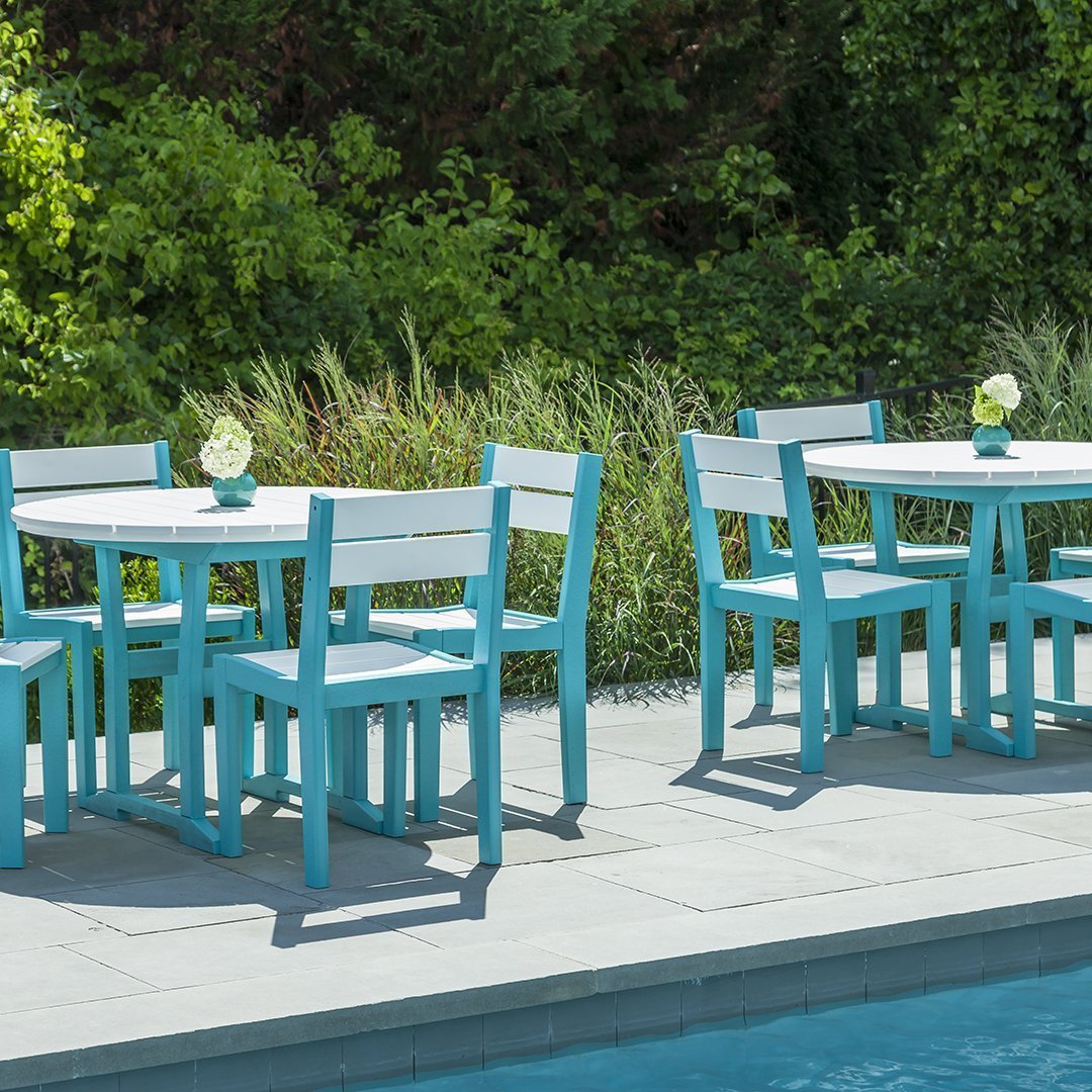 "Bright turquoise and white outdoor dining set with a sleek design, perfect for poolside gatherings."