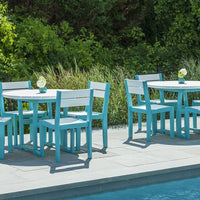 "Bright turquoise and white outdoor dining set with a sleek design, perfect for poolside gatherings."