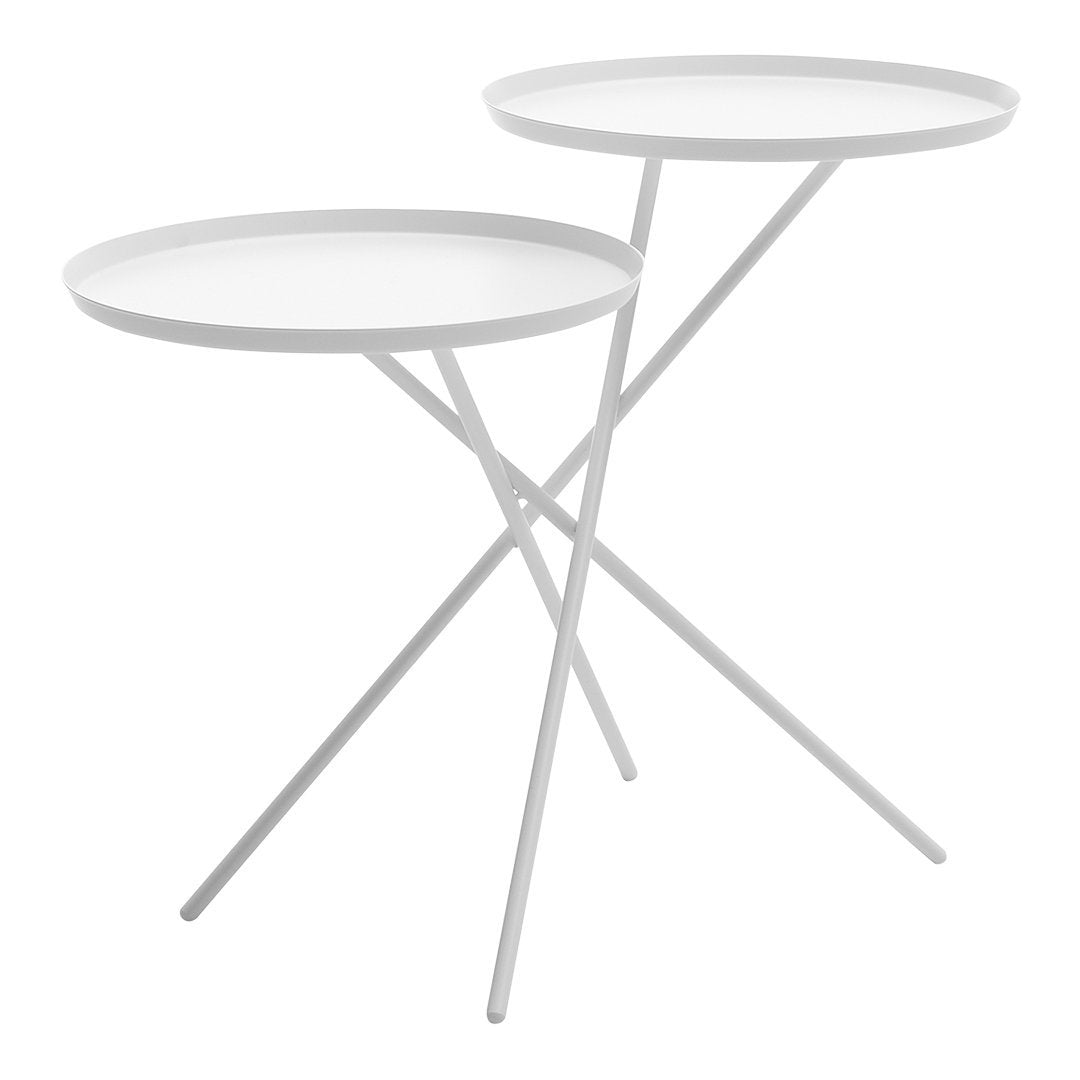 White minimalist side tables with circular trays and a sleek, modern cross-legged design.