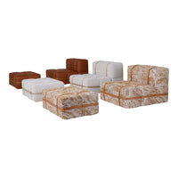 Textured furniture pieces in warm brown, white, and abstract patterned fabric for a cozy living space.