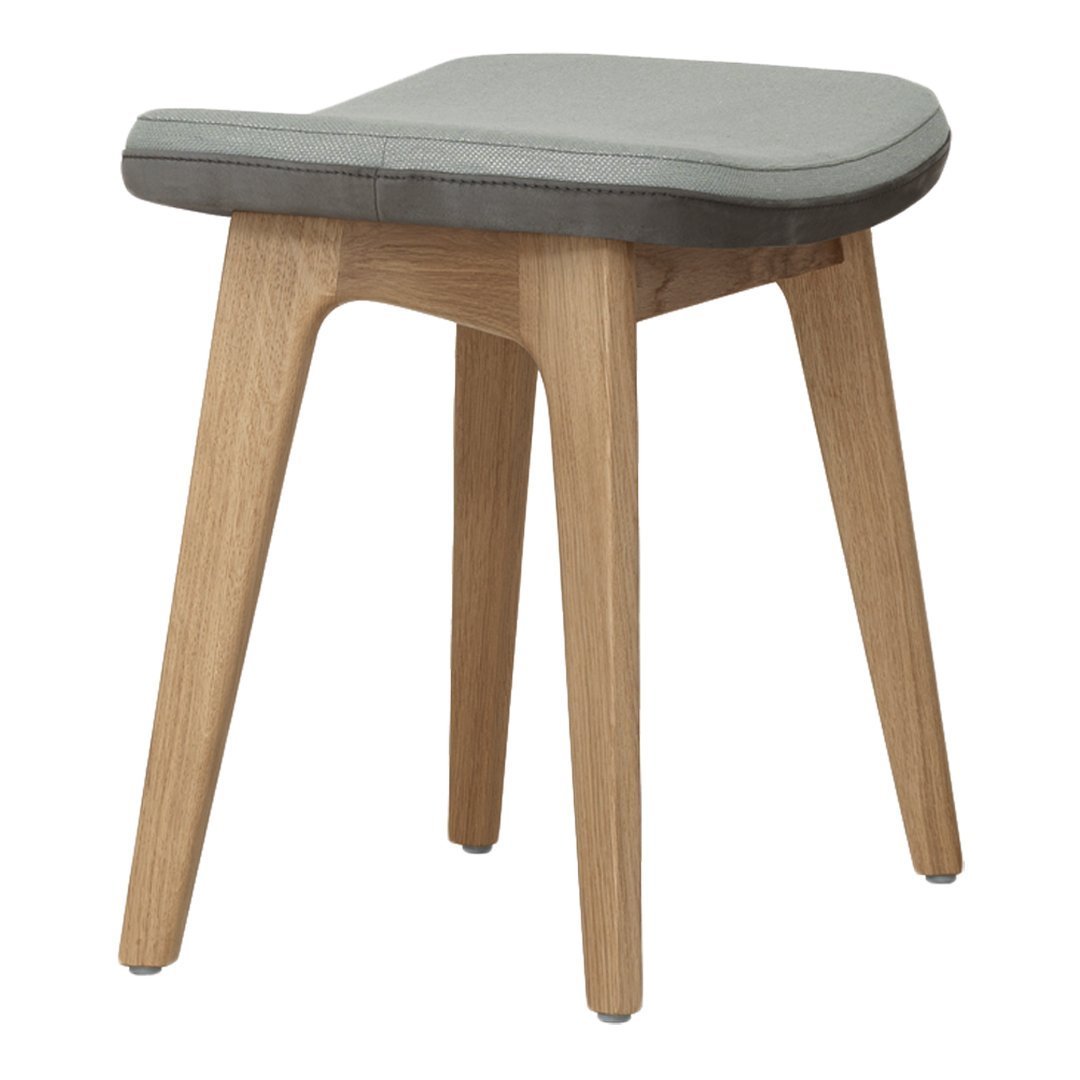 Gray cushioned stool with natural wood legs, featuring a modern minimalist design. Perfect for any decor style.