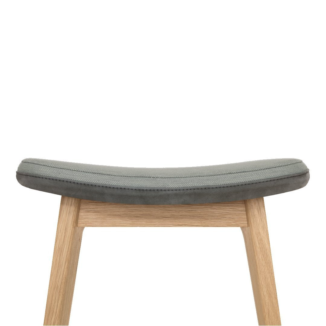 Gray upholstered seat with smooth texture, complemented by natural wood legs for a minimalist look.