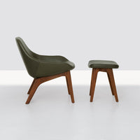 Olive green cushioned stool with sleek wooden legs in rich brown tones. Modern, minimalist design for home decor.