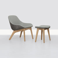 Gray cushioned stool with natural wood legs, featuring a modern minimalist design. Perfect for any decor style.