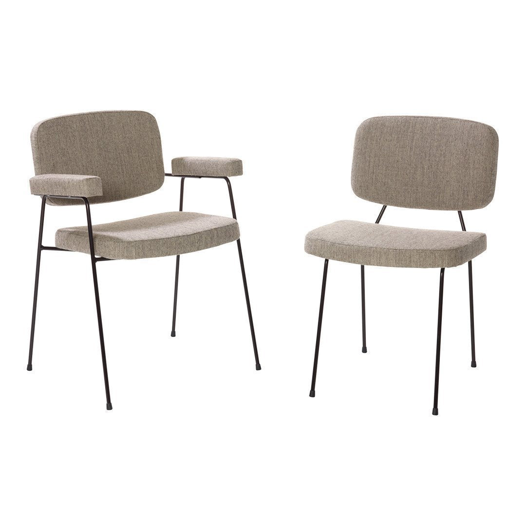 "Pair of beige upholstered chairs with subtle texture and black metal legs, featuring a minimalist design."