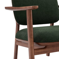Green upholstery with a textured finish, complemented by a warm walnut wood frame. Elegant and modern design.