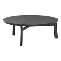 Round black coffee table featuring a sleek, textured finish and minimalist design. Perfect for modern living spaces.
