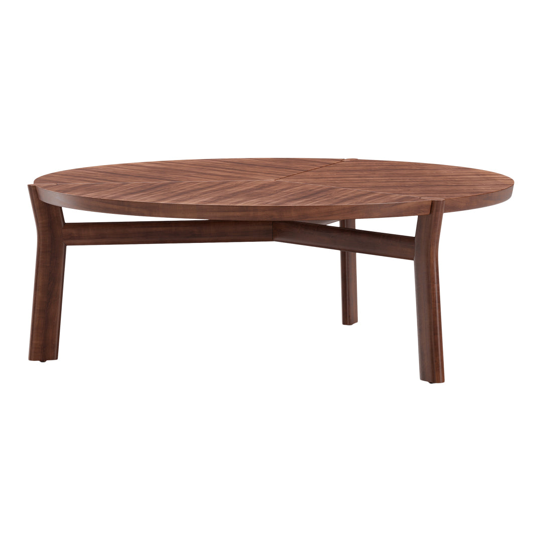 Round wooden dining table in rich walnut finish with a geometric pattern on the surface and sleek, slender legs.