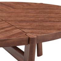 Round wood table with rich walnut finish and smooth, natural grain pattern. Ideal for modern aesthetics.